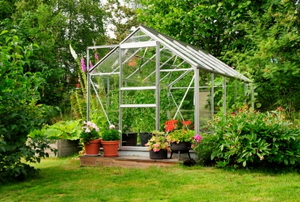 A greenhouse full of flowers and plants.