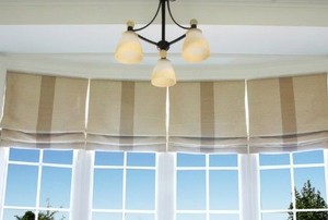 roman shades in a white room