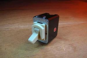 A detached despard switch sitting on a flat surface