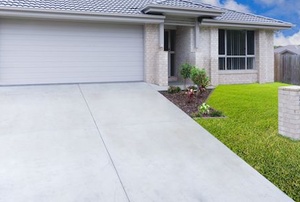 A cement driveway.