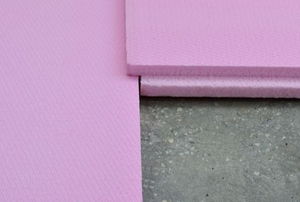 pink foam insulation on a concrete wall