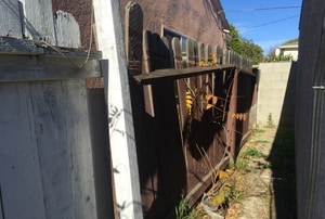 An old fence needing repairs.