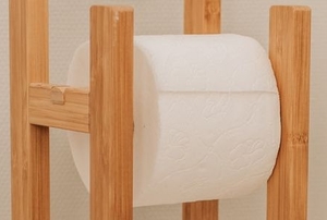 toilet paper roll on wooden freestanding holder
