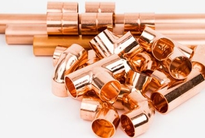 bright copper pipes with fitting connectors