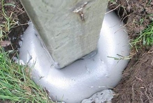 cedar post mounted in the ground