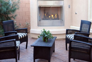 patio with furniture and fireplace