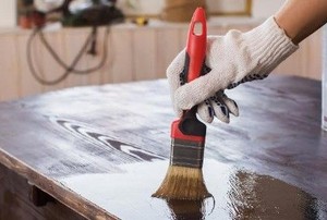 hand painting a table