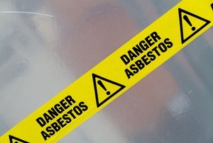 A sign says "danger asbestos."