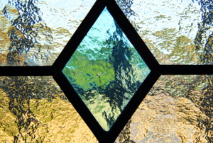 leaded glass window with diamond shape in center