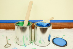 Two cans of open paint