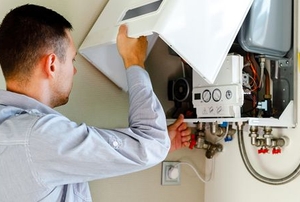 person repairing boiler device