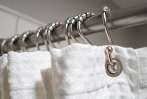 shower curtain rod with white curtain