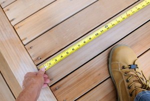 taking a measurement on a deck
