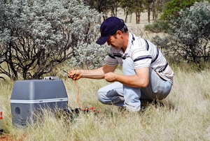 Man setting up camping refridgerator