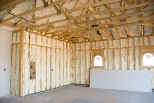 Spray foam insulation in the walls of an unfinished room.