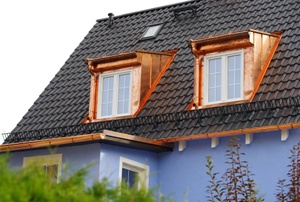 house with copper dormers and gutters