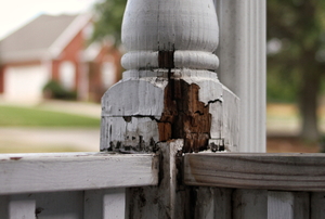 wood railing with rotting section