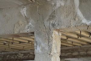 A cracked cement column.