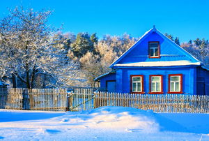 A home surrounded by snow in the winter