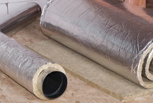 air duct on floor wrapped in metalic coated insulation