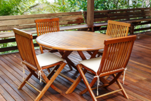 Teak dining set on a deck
