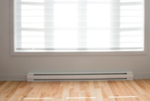 Baseboard heater along a white wall