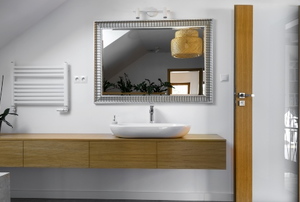 a clean minimalist bathroom with floating vanity and sink
