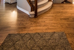 an area rug in front of stairs