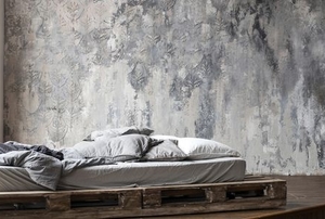 venetian plaster in room with pallet bed