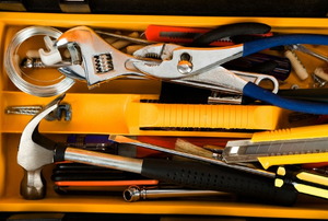 A tool box with tools for a variety of repairs.