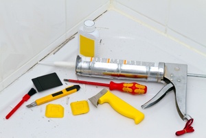 Assorted tools for tile grout removal.