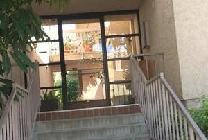 The outside of a condo building.