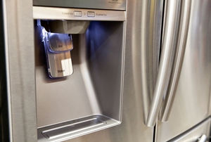 stainless steel fridge with frontal water and ice dispenser