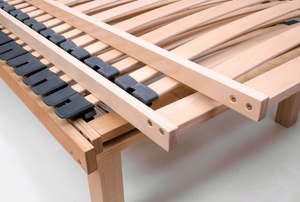 pile of wood slat beds stacked on one another