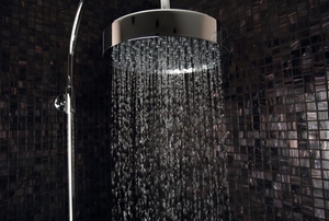 modern silver shower head dispensing water