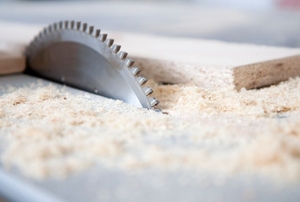 table saw cutting through wood