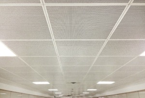 An office ceiling with mesh tiles.