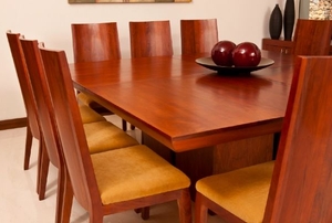 Wooden chairs at a dining room table.
