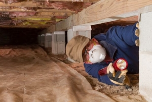 A man in a crawlspace.
