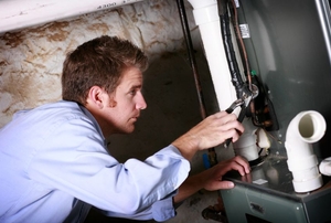 Man repairing a furnace