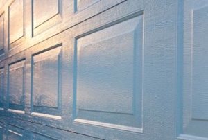 Dawn reflects off of a white garage door.