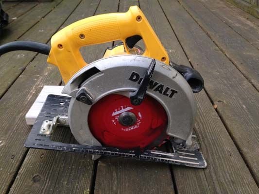 Make your cut, being careful not to cut into the board in front or in back of th