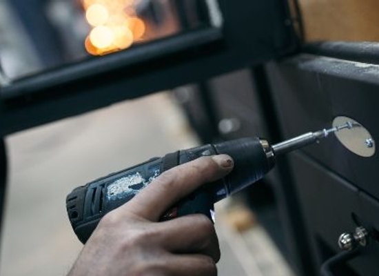 repairing stove with drill