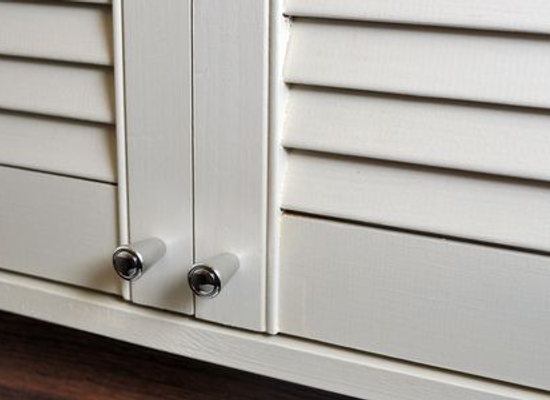 white painted louvered (slatted) closet doors
