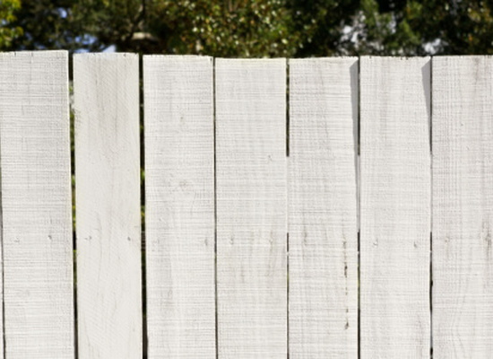 Whitewashed wood fence