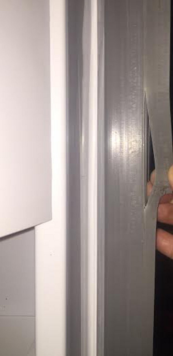 A split gasket on a refrigerator. 