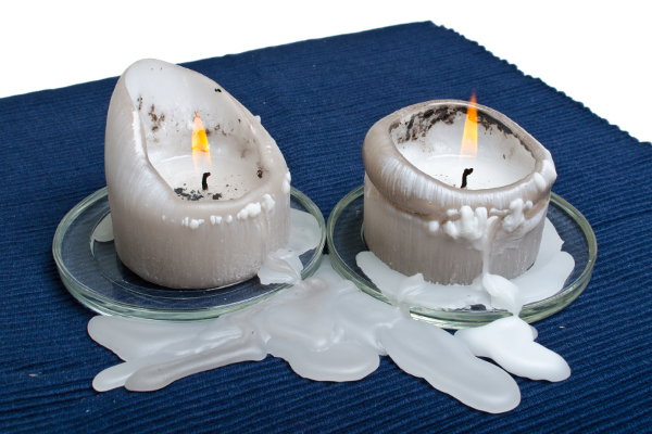Melted candles on a tablecloth