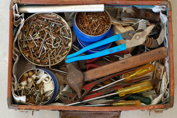 If you can get your hands on one, a wooden tool box is actually the best home fo