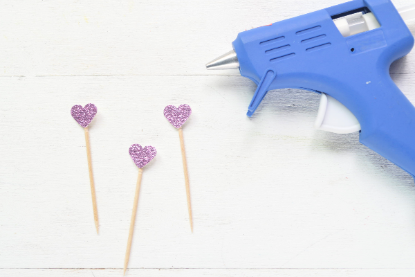 glue cupcake toppers to toothpicks