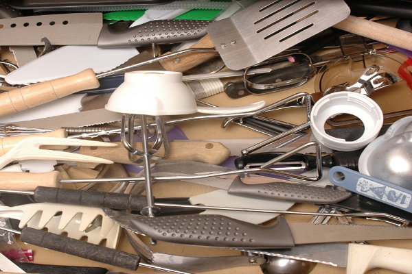 A drawer with kitchen utensils. 